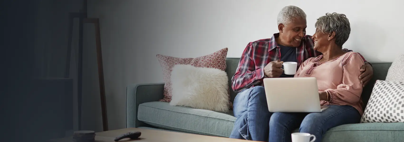 Couple sitting on a couch having a discussion